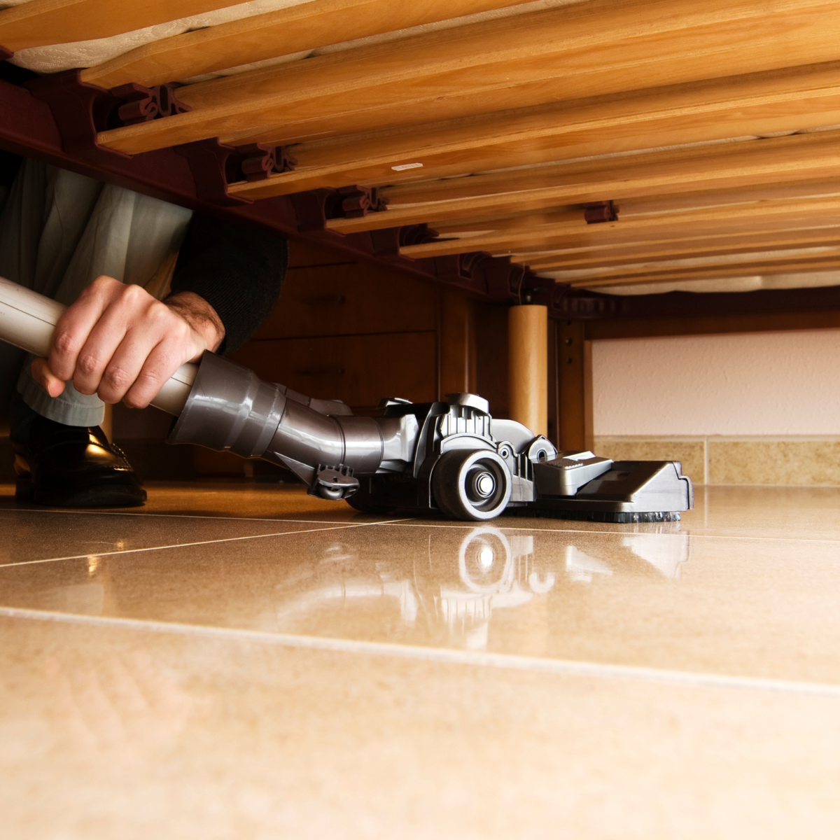 Vacuuming under beds